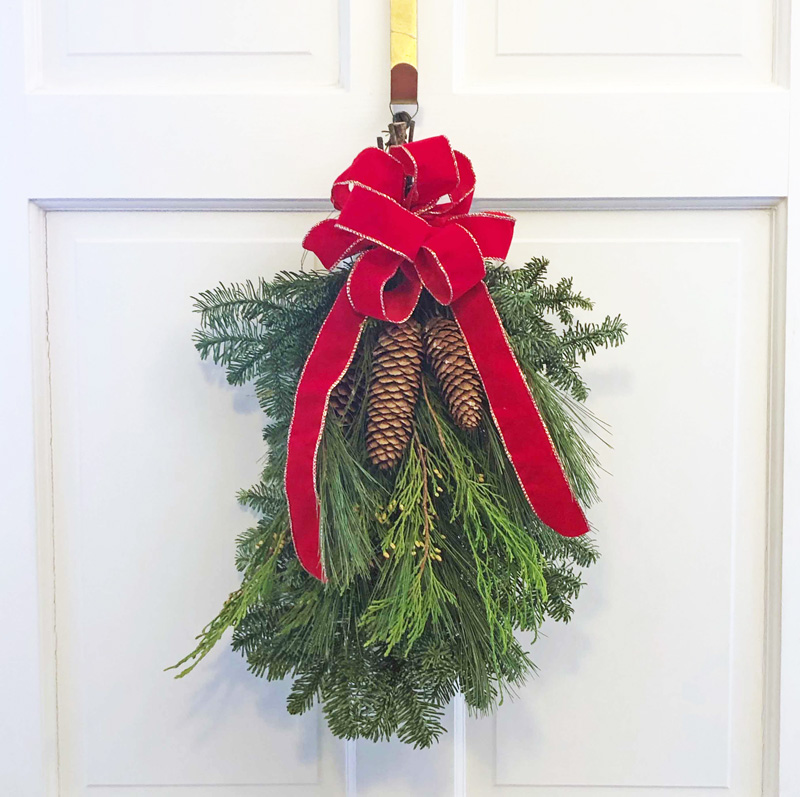 Small Swag with Red Bow, evergreens & pine cones