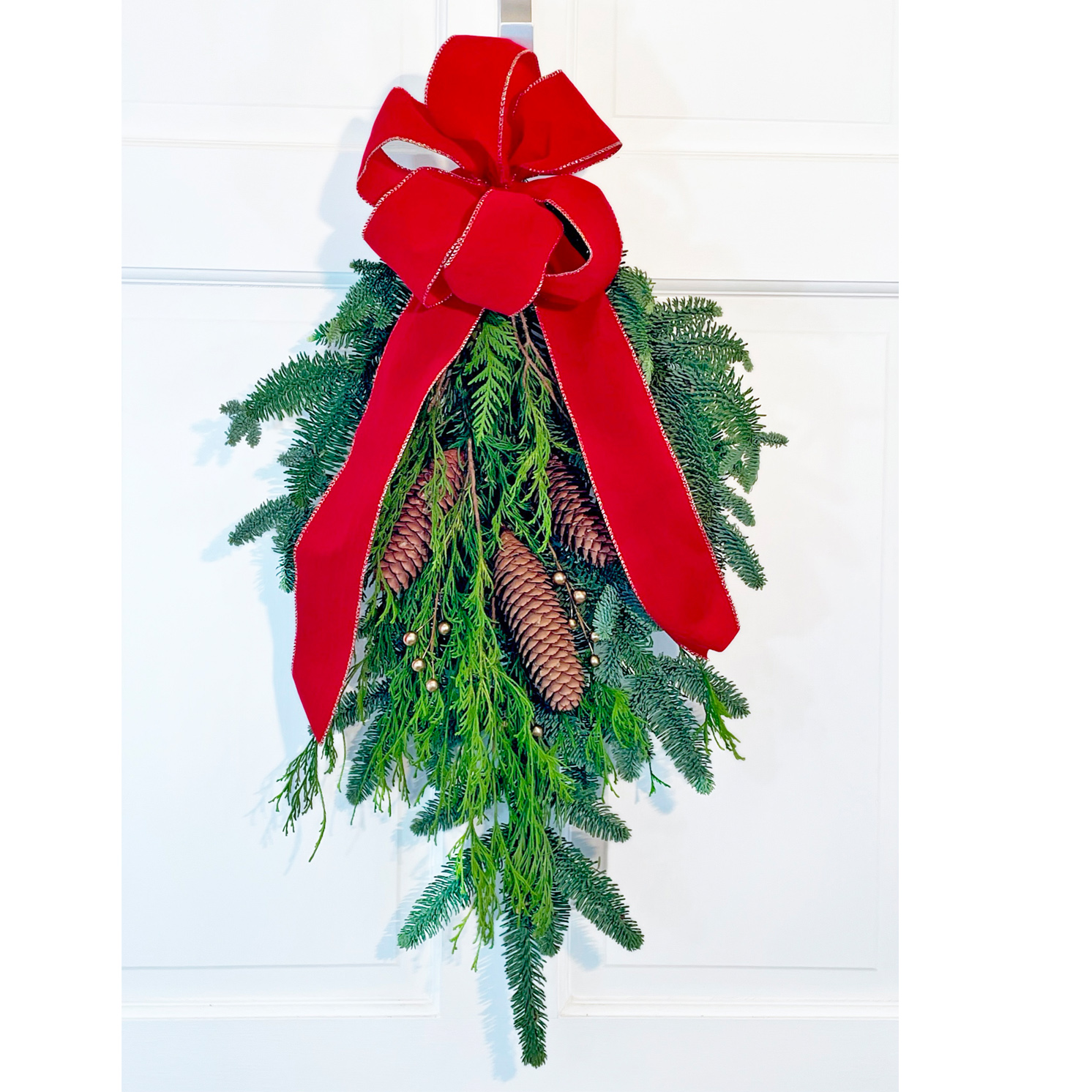 Large Swag with evergreens, pine cones & bow