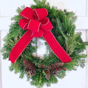 22" Wreath with Red bow, decorated with greens & pine cones
