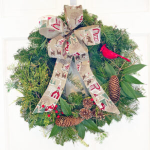 22" Wreath with Winter Scene Bow, decorated with greens, pine cones & berries